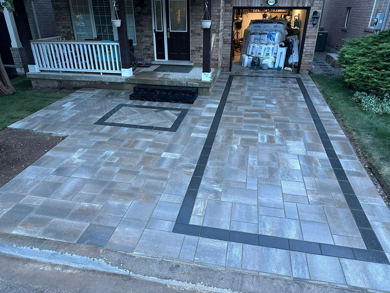Cedar privacy fence bordering new interlocking patio