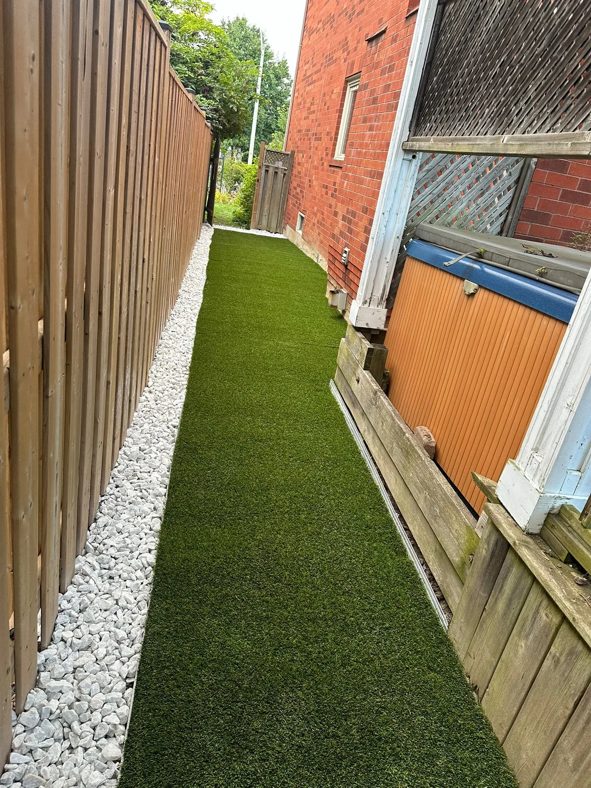 Paver walkway winding through landscaped garden