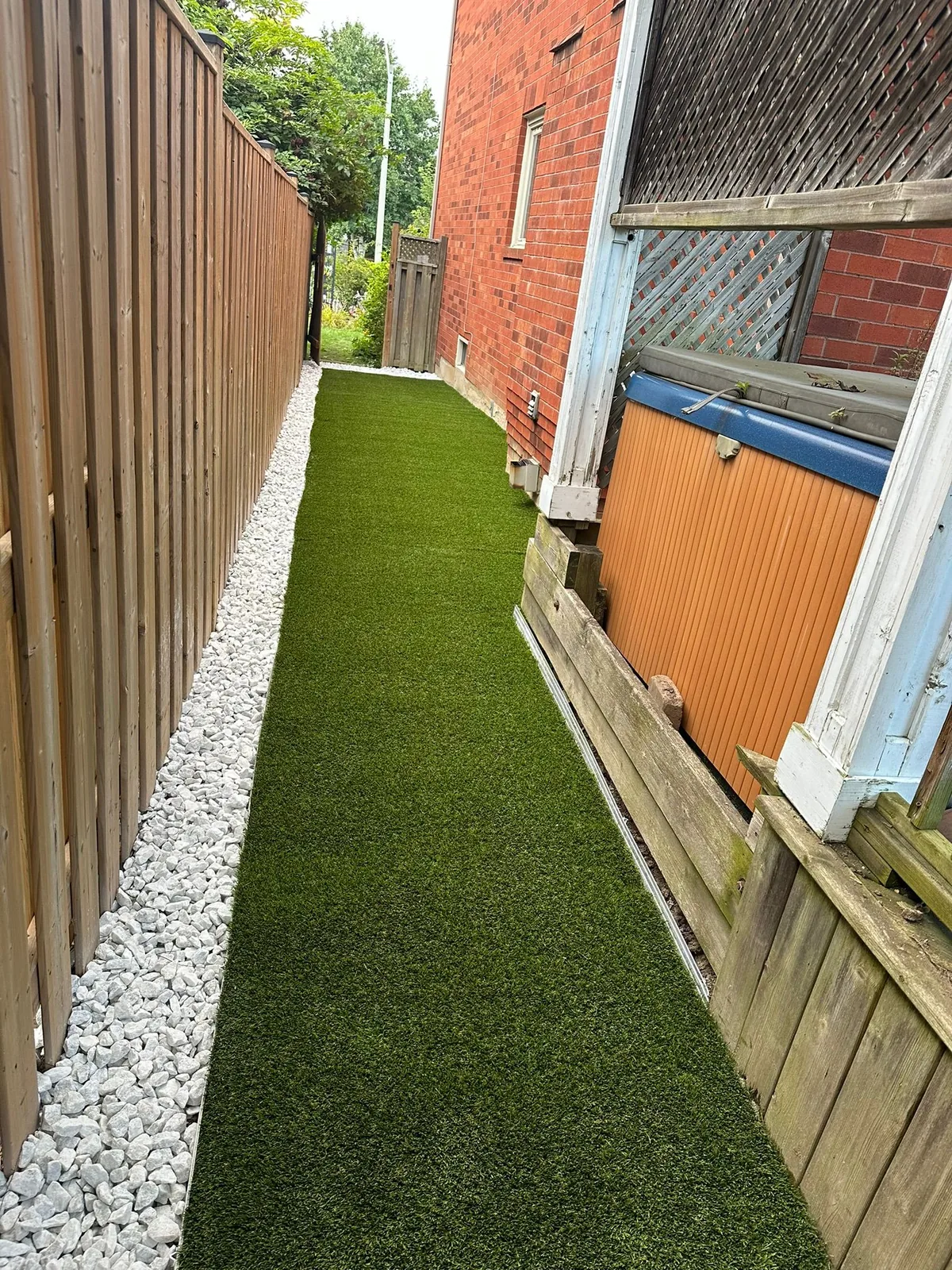 Landscaped front yard with interlocking walkway