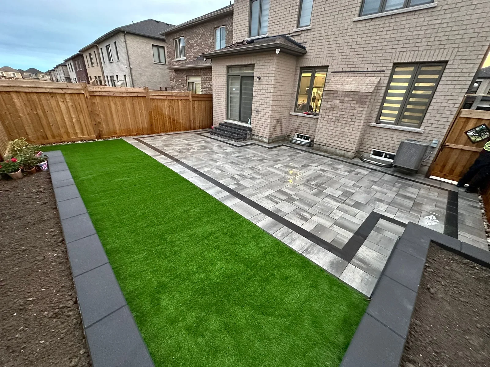 Front entrance with stone accents and plantings